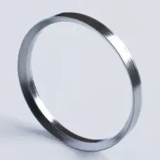 Single beveled graphite self-sealing ring shown at an angle on a light background.