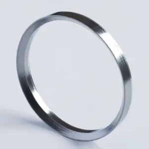 Single beveled IKSONIC JT-RG730 graphite self-sealing ring shown at an angle on a light background.