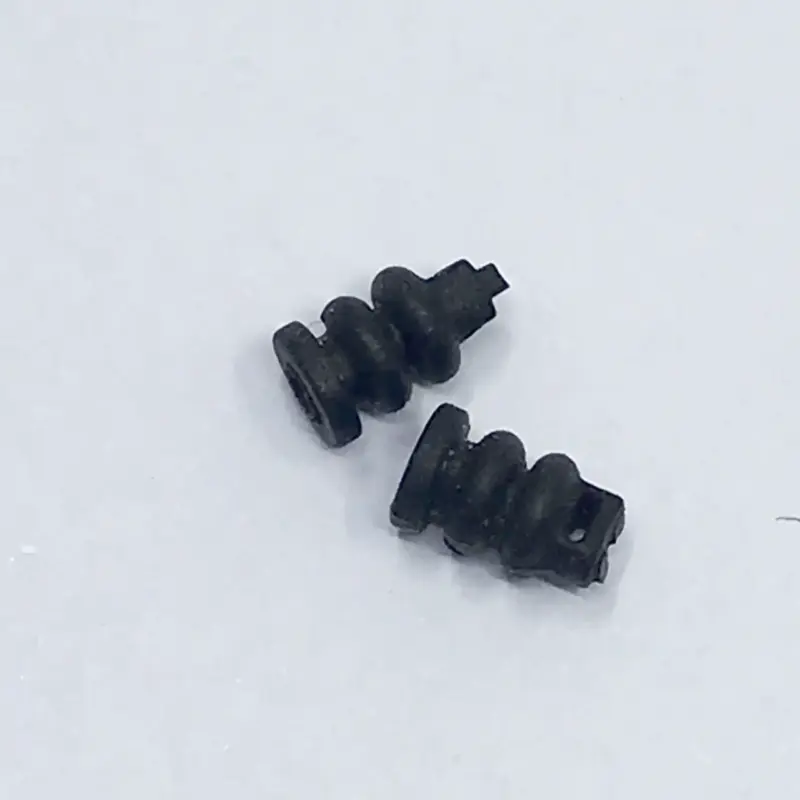 Close-up of two black gimbal dampers on a light background, listed by the supplier for DJI Mavic Air 2 repair.