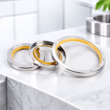 stainless steel oil seals with yellow PTFE lips, three overlapping seals showing front and reverse sides; supplied by IKSONIC in China.