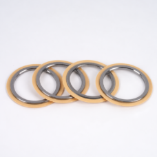 Four vacuum pump shaft seal rings with dark gray inner lips and gold-colored outer lips, shown in a slightly staggered overlapping row; supplied by IKSONIC in China.