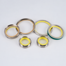 Six assorted vacuum pump shaft seal rings supplied by IKSONIC, with four larger rings behind two smaller yellow-centered rings on a light gray background.