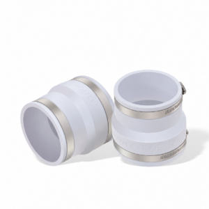 Two IKSONIC white flexible PVC ventilation duct couplings with metal band clamps, one upright and one on its side.