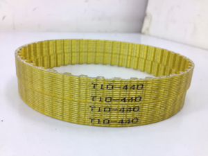 Stacked IKSONIC T10-440 PU steel-cord timing belts with visible model markings and inner teeth.