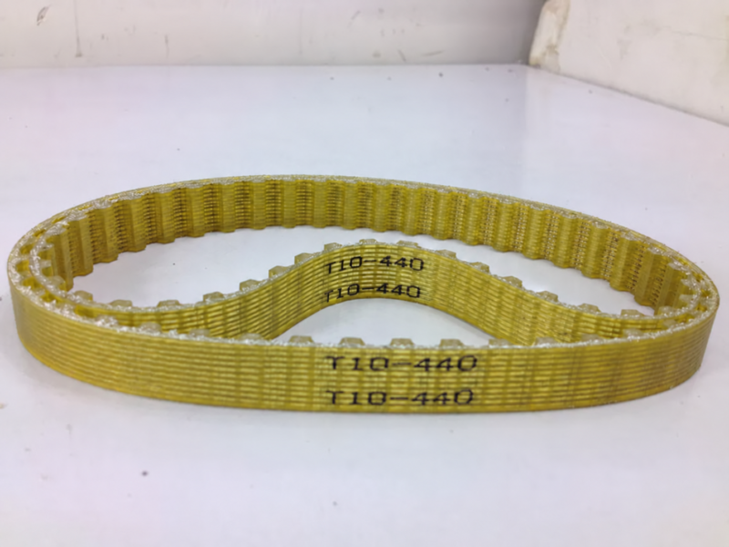 Side view of IKSONIC T10-440 timing belt loops showing teeth and steel-cord lines.