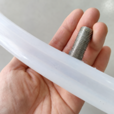 Translucent inflatable seal held in a hand, showing its threaded valve from the side; IKSONIC China supplier.