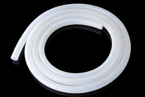 Small coil of translucent IKSONIC silicone tubing with two visible cut ends.