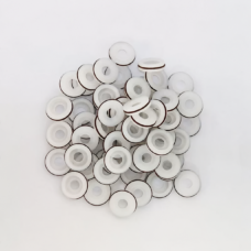 White dispensing valve seals in a bulk group showing bores and dark outer bands, available wholesale from IKSONIC.