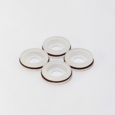 Four white dispensing valve seals with dark outer bands, supplied by IKSONIC China.