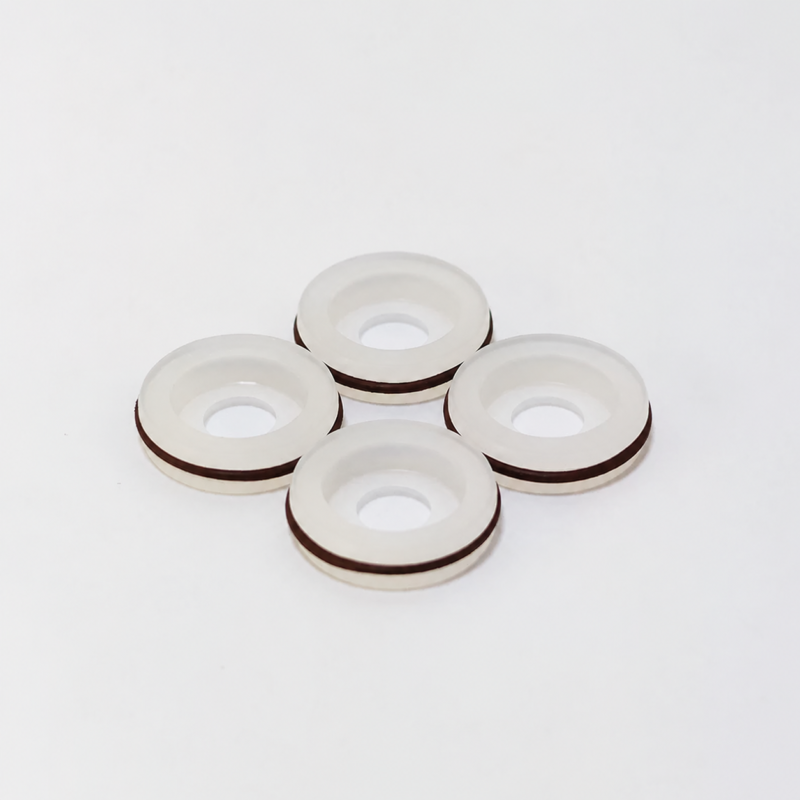 iksonic-upe-dispensing-valve-seal-four-piece-view-493-hero-09 Four white dispensing valve seals with dark outer bands, supplied by IKSONIC China.
