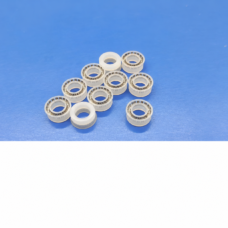 White UPE dispensing valve seal examples showing spring inserts and reverse faces, IKSONIC supplier