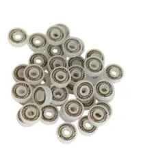 White UPE spring-energized dispensing seals showing recessed spring channels, supplied by IKSONIC China.