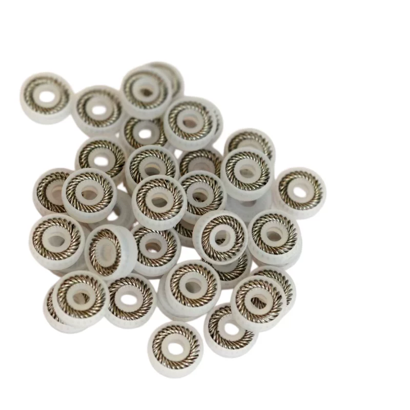 IKSONIC UPE Spring-Energized Seal Assortment White UPE spring-energized dispensing seals showing recessed spring channels, supplied by IKSONIC China.