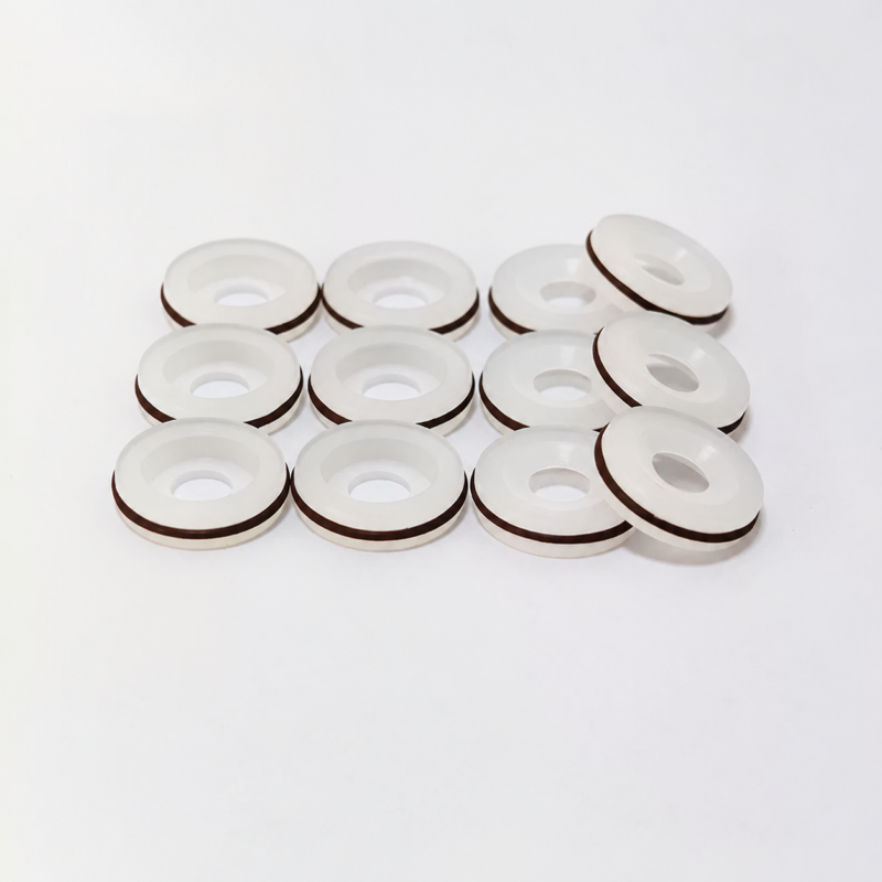 White dispensing valve seals showing recessed faces and reverse sides, IKSONIC product view.