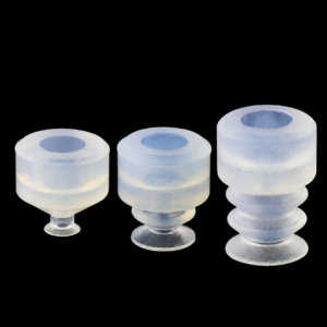 Three translucent IKSONIC vacuum suction cup profiles with mounting openings.