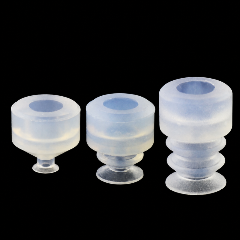IKSONIC vacuum suction cups in three profiles Three translucent IKSONIC vacuum suction cup profiles with mounting openings.