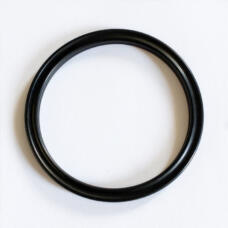 Single black sealing ring viewed from above, showing its grooved circular profile.