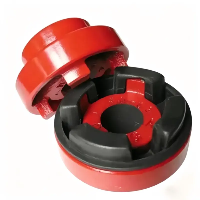 NM coupling set with elastic insert Red coupling halves shown separated, with a black lobed insert seated in the front half.
