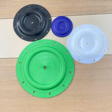 Four pump diaphragms in black, blue, green and translucent white, showing different sizes and mounting-hole patterns.