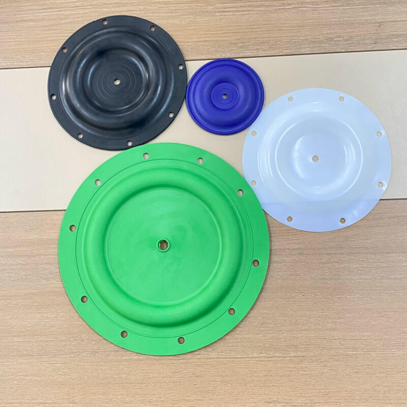 Four pump diaphragms in black, blue, green and translucent white, showing different sizes and mounting-hole patterns.