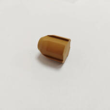 Brown ribbed valve component resting on its side on a white surface.