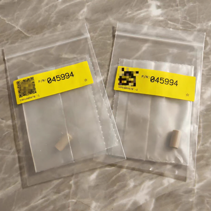 Two small beige seal components in individual clear packages labeled P/N 045994.