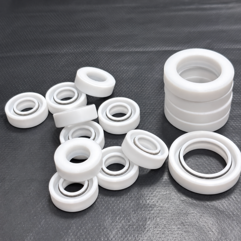 White TC rotary shaft seals in several sizes, some showing dark inner rings.